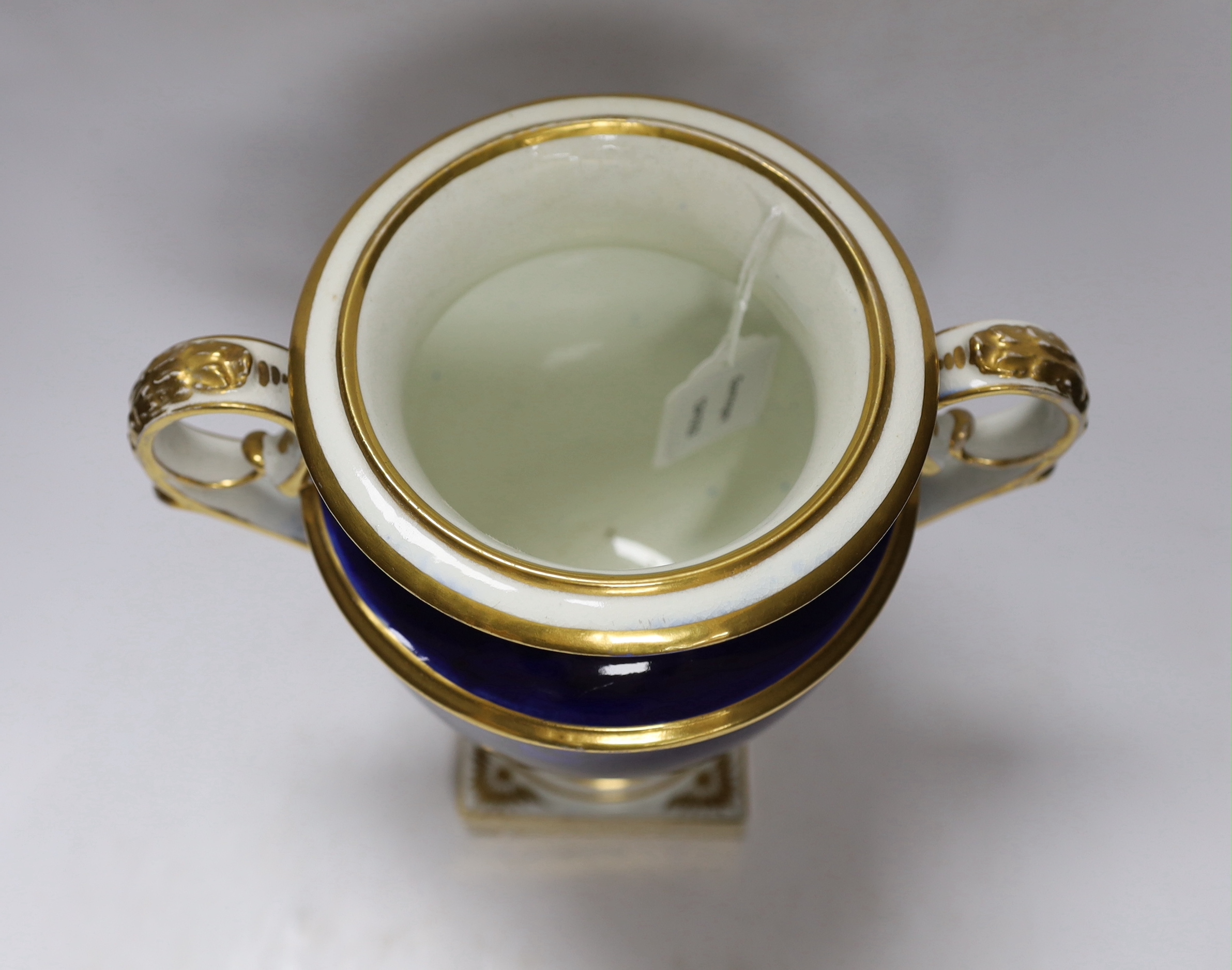 A garniture of three early 19th century Derby vases painted with fruit, tallest 23cm
